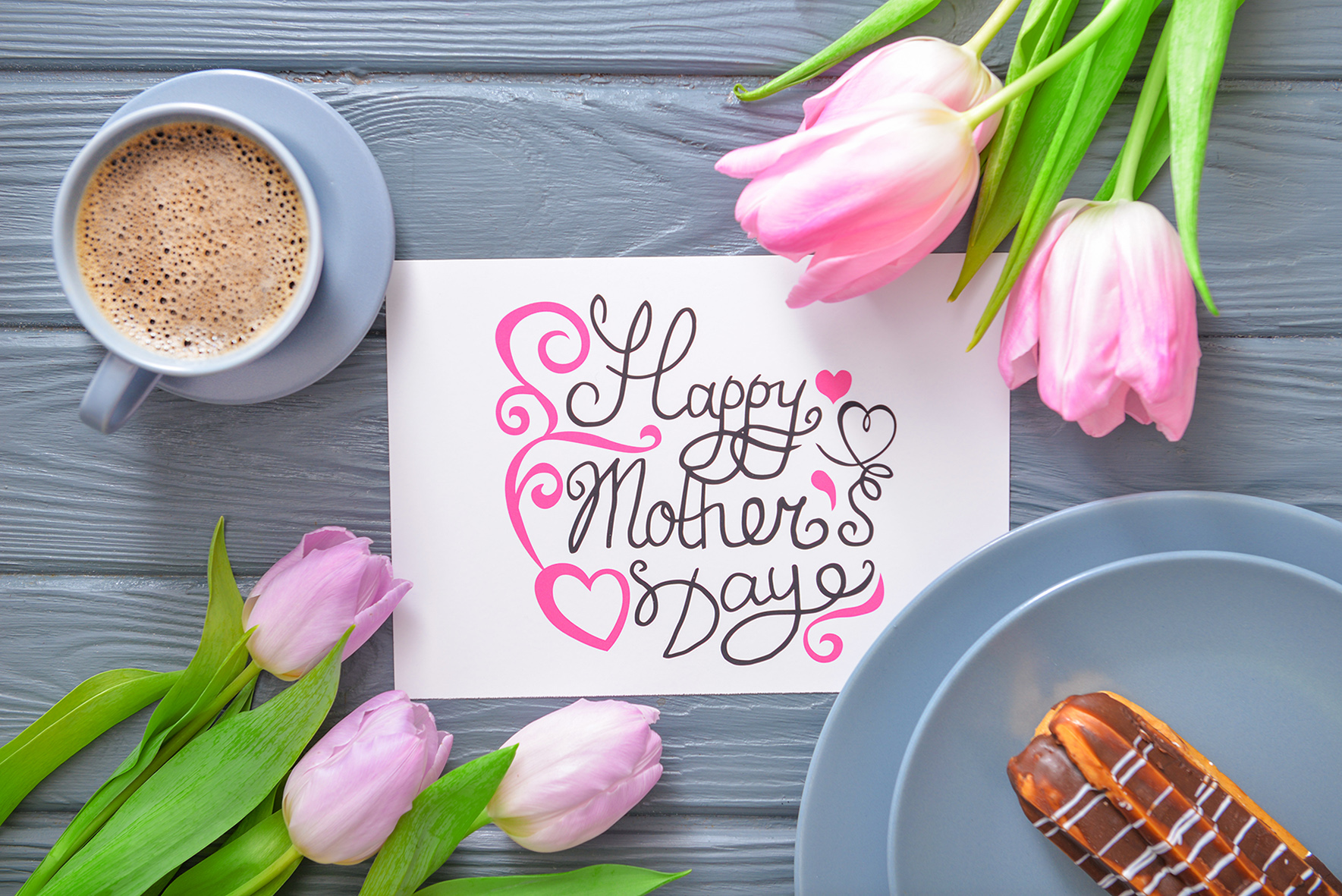Tasty breakfast for mother on wooden background